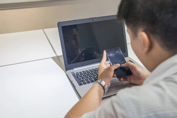 Young Asian businessman working alone in the office