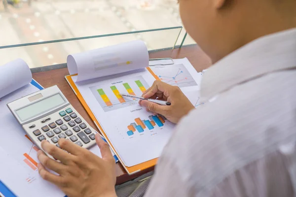 Young businessman reading financial report — 스톡 사진