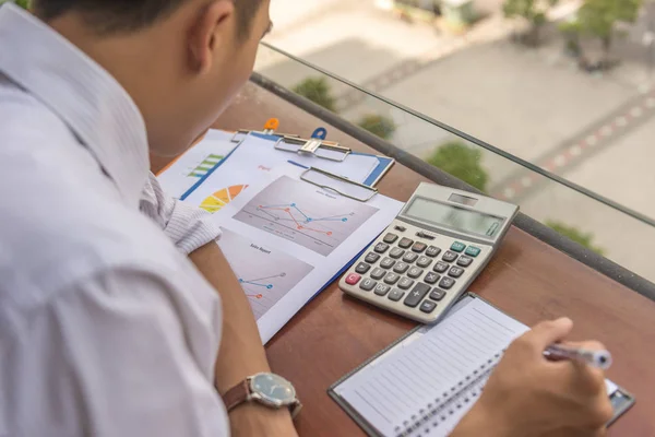 Man reading financial documents — 스톡 사진