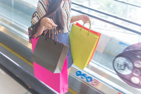 Young girl hurry after shopping in the mall — 스톡 사진