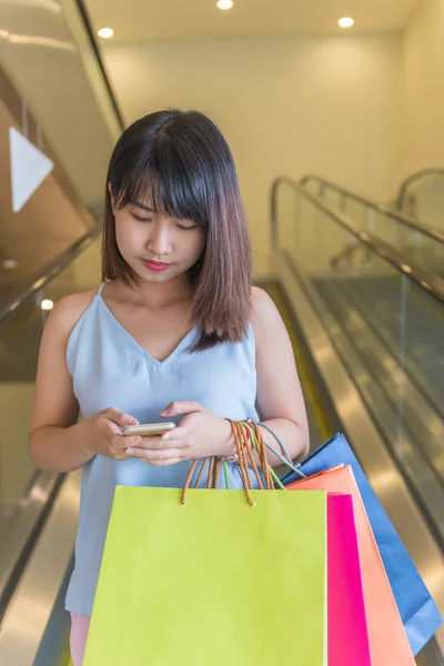 Shopaholic girl checking online shopping deals — 스톡 사진