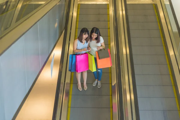 Asian women carrying shopping bags — 스톡 사진