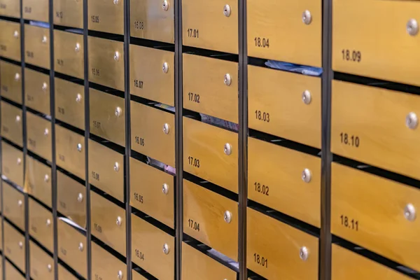 Letter mailbox rows in postal room of condominium building — Stock Photo, Image