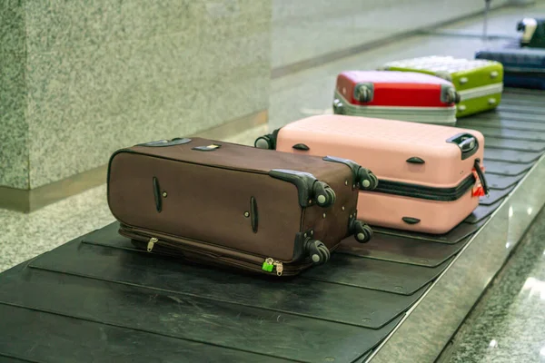 Travel suitcase at the international airport — Stock Photo, Image