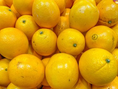 Heap of fresh oranges for sale at fruit market
