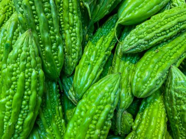 Full frame background photo of bitter melons at groceries store
