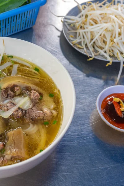 Vertical photo of noodle soup on the table — ストック写真