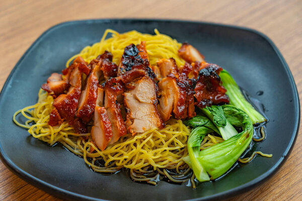 Delicious Chinese honey grilled pork belly meat noodle 