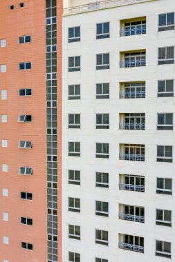 Apartment building exterior with sloughing paint on the wall clipart