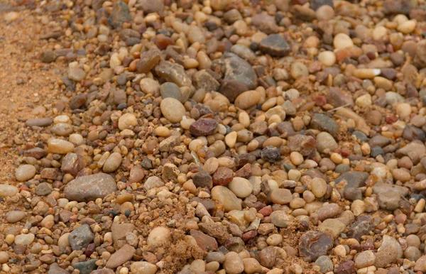 textured background of stones and river sand