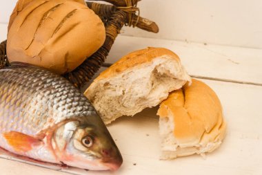 fish and breads on white background clipart