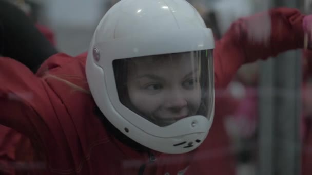 Portrait young woman skydiver flying in wind tunnel. Parachuting and skydiving — Stock Video