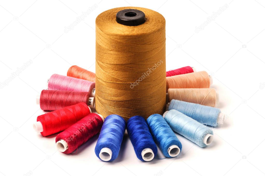 Colored bobbins isolated on white background. Colorful cotton ya