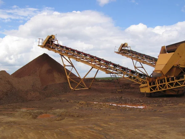 conveyor belts transport ore into a pile