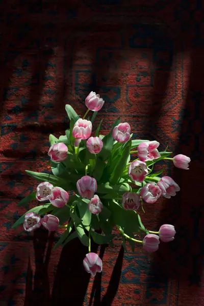 Tulip flowers arrangement on carpet — Stock Photo, Image