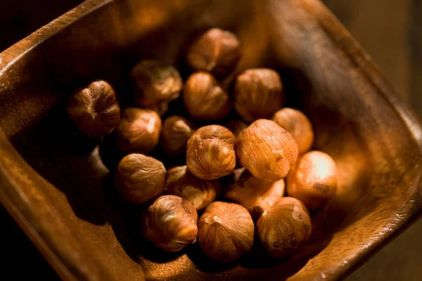 Shelled hazelnuts in bowl — Stock Photo, Image