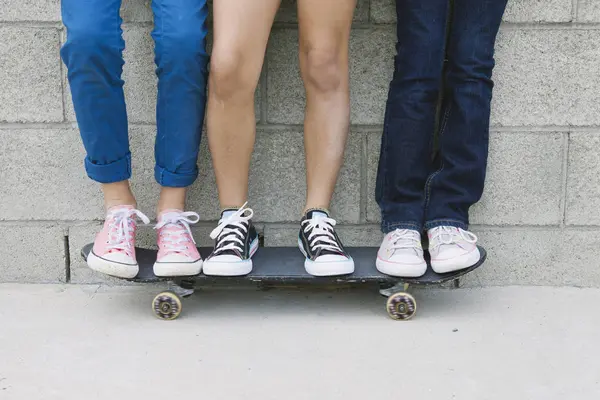 Three Girls Standing Skateboard Low Section — Stock Photo, Image