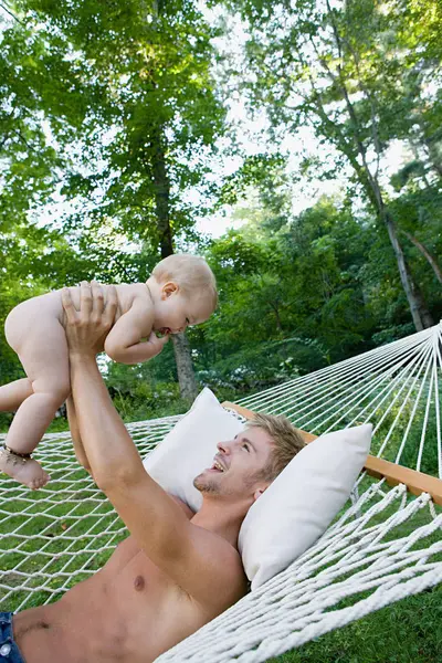 Father Hammock Lifting Baby Daughter — Stock Photo, Image