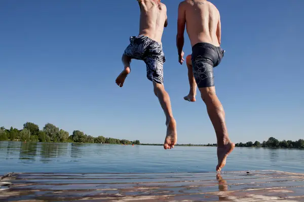 Father Son Jumping Lake — Stock Photo, Image