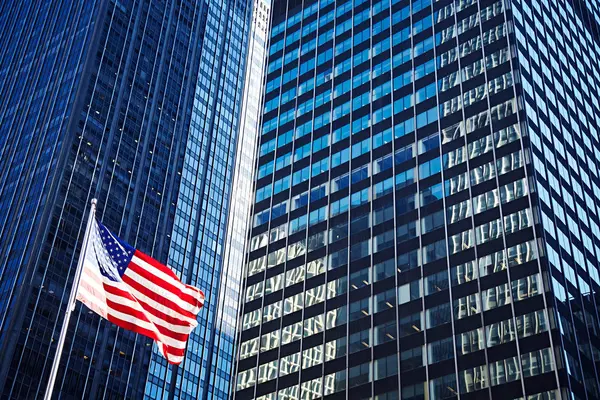 Skyscrapers exterior and US flag — Stock Photo, Image