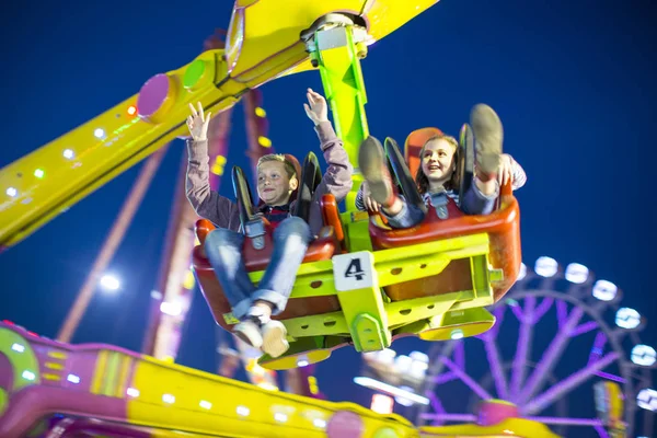 Sister Brother Mid Air Fairground Ride Night — Stock Photo, Image