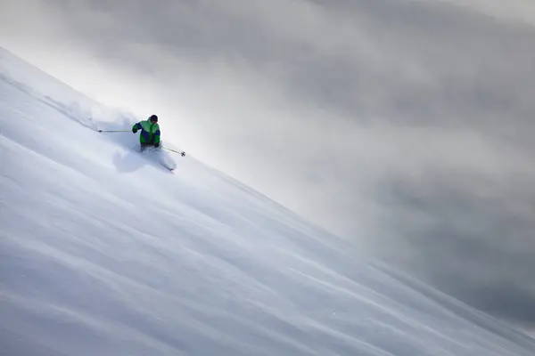 Man Skiing Snowy Hillside — Stock Photo, Image