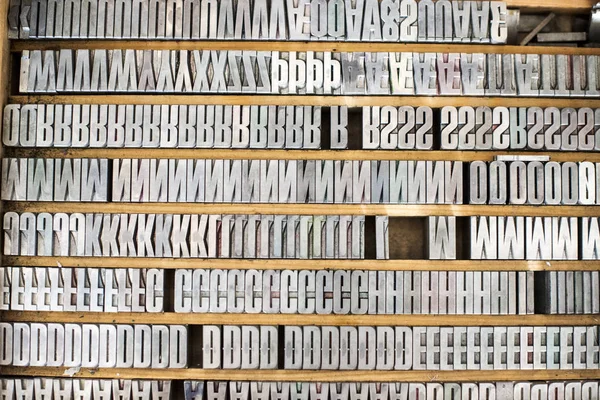 Shelves of silver letterpress letters — Stock Photo, Image