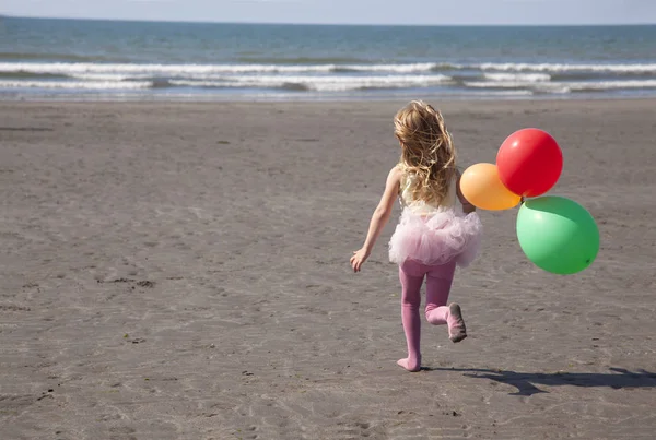 Girl Beach Wearing Tutu Holding Balloons Wales — Stock Photo, Image