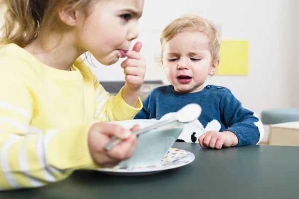 Sister Testing Temperature Feeding Baby Brother — Stock Photo, Image