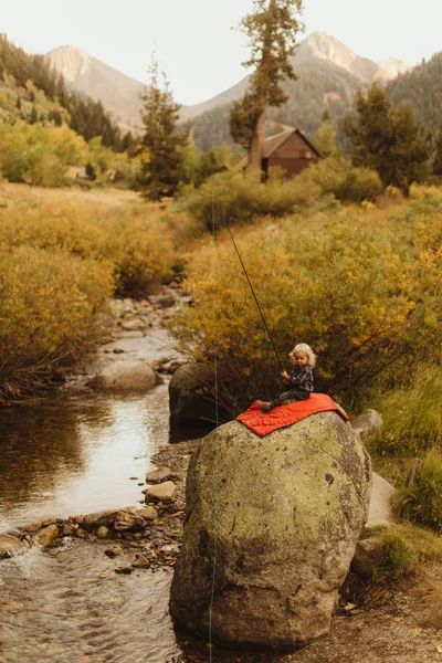 Young Boy Sitting Rock Next Creek Holding Fishing Rod Mineral — Stockfoto