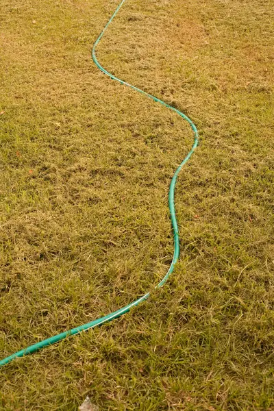 High Angle View Green Hosepipe Grassy Lawn — Stock Photo, Image