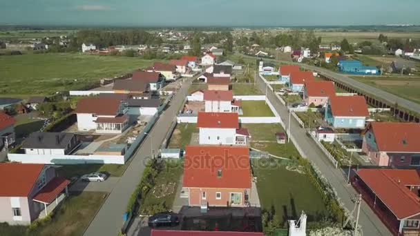 Aerial survey rural valley among hills, flight over small houses with red roofs — Stock Footage Aerial survey rural valley among hills, flight over small houses with red roofs Royalty Free Stock Video