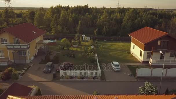 Aerial survey rural valley among hills, flight over small houses with red roofs — Stock Footage Aerial survey rural valley among hills, flight over small houses with red roofs Royalty Free Stock Footage