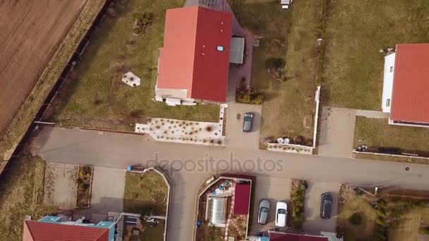 Aerial survey rural valley among hills, flight over small houses with red roofs — Stock Footage Aerial survey rural valley among hills, flight over small houses with red roofs Stock Footage