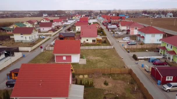 Aerial survey rural valley among hills, flight over small houses with red roofs — Stock Footage Aerial survey rural valley among hills, flight over small houses with red roofs Royalty Free Stock Footage