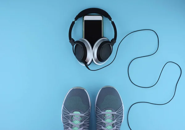 Flat lay shot of sneakers, earphones, phone. — Stock Photo, Image