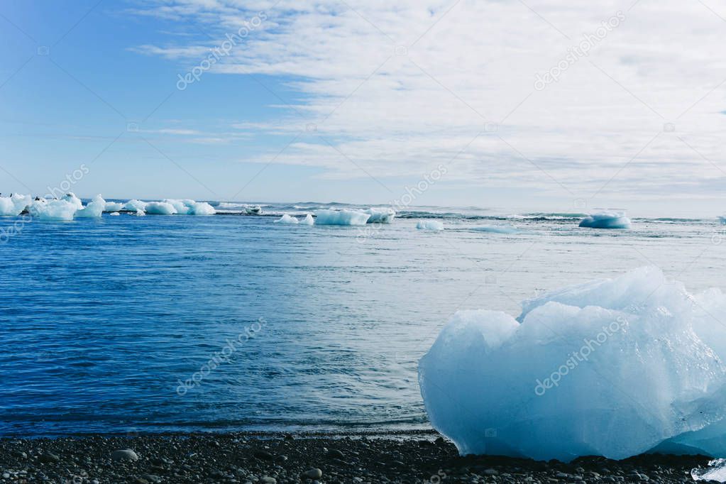 Black Iceland beach with diamond ice blocks.