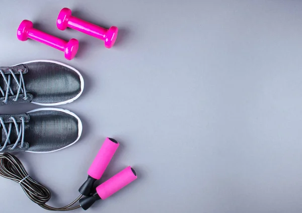 Flat lay shot of sneakers, jumpung rope and dumbbells. — Stock Photo, Image