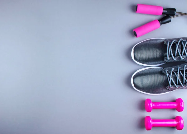 Flat lay shot of sneakers, jumpung rope and dumbbells. — Stock Photo, Image