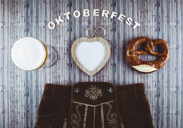 Oktoberfest beer festival on rustic background. — Stock Photo, Image