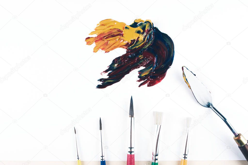 Multicolor oil paint brush strokes with knife.