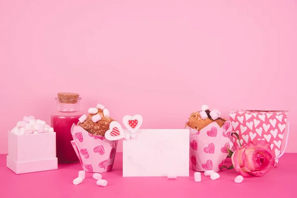 Muffins in colorful paper baking cup with red hearts. — Stock Photo, Image