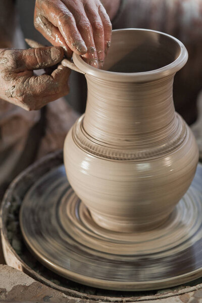 Potter working a piece of clay