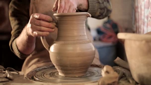 Potter making jug. Close-up of potter making ceramic jug on at his workshop — Stock Video