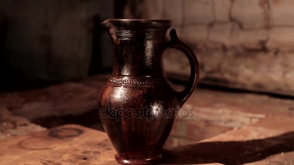 Potter at work. Close-up of potter making ceramic jug on at his workshop — Stock Video