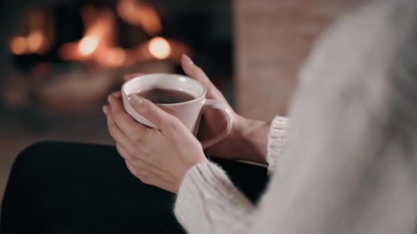 Girl relaxing after long day by the fireplace — Stock Video