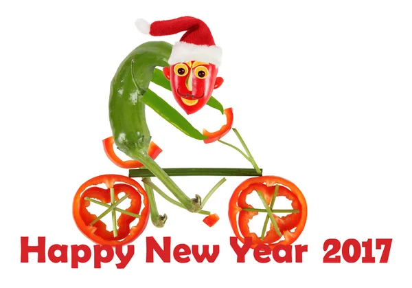Komik biber bir bisiklet üzerinde. Yeni Yılınız Kutlu Olsun — Stok fotoğraf