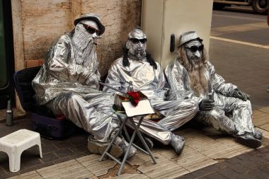 Street artists. Street artists performing in central Rome, Italy clipart