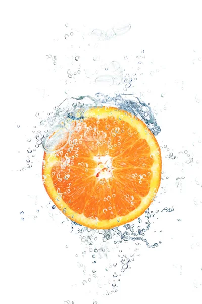 Fresh orange falling in water — Stock Photo, Image