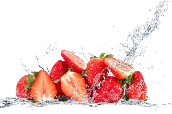 Fresh strawberry falling in water — Stock Photo, Image